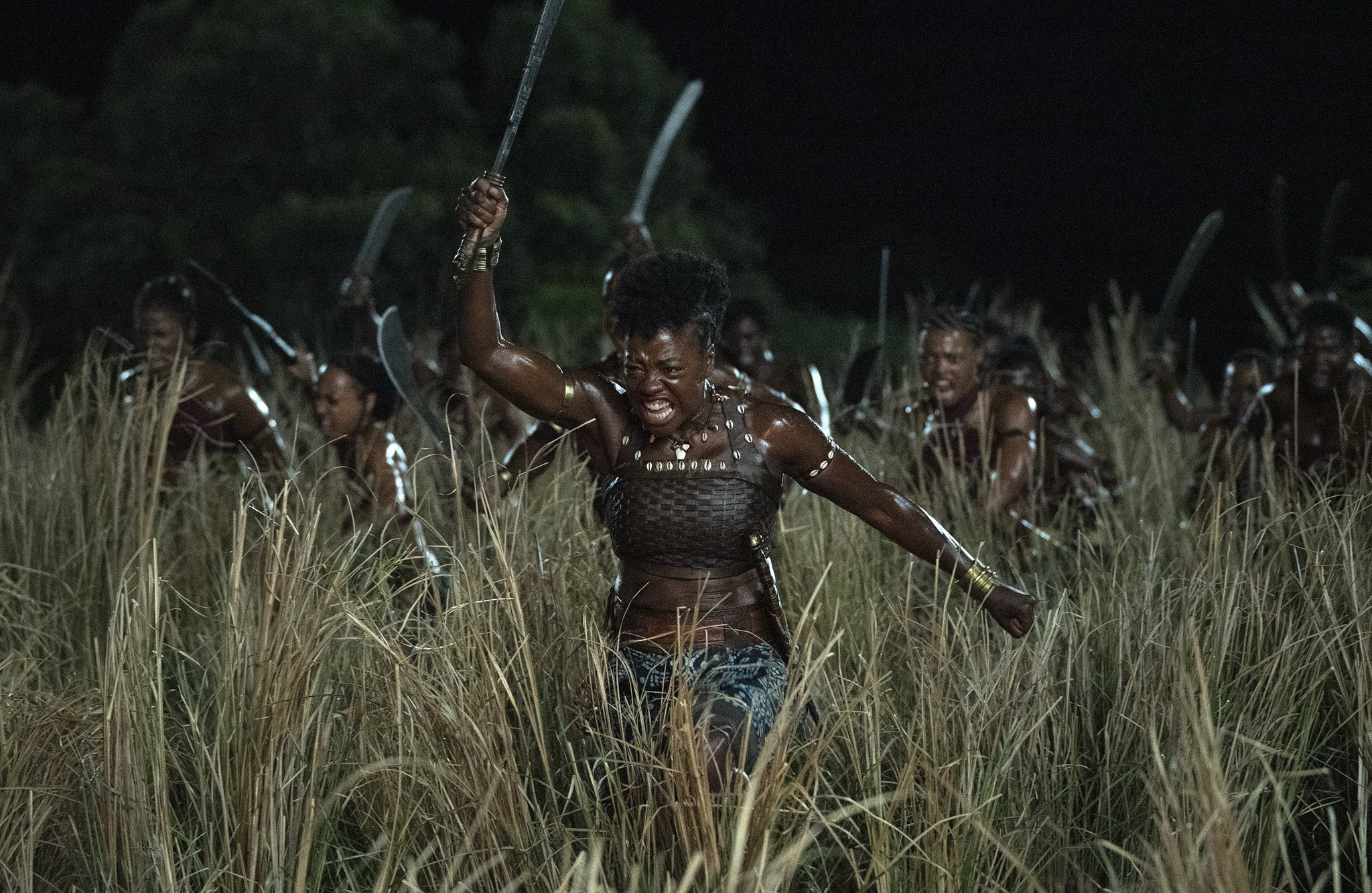 Viola Davis in character leading an army into battle in ‘The Woman King’