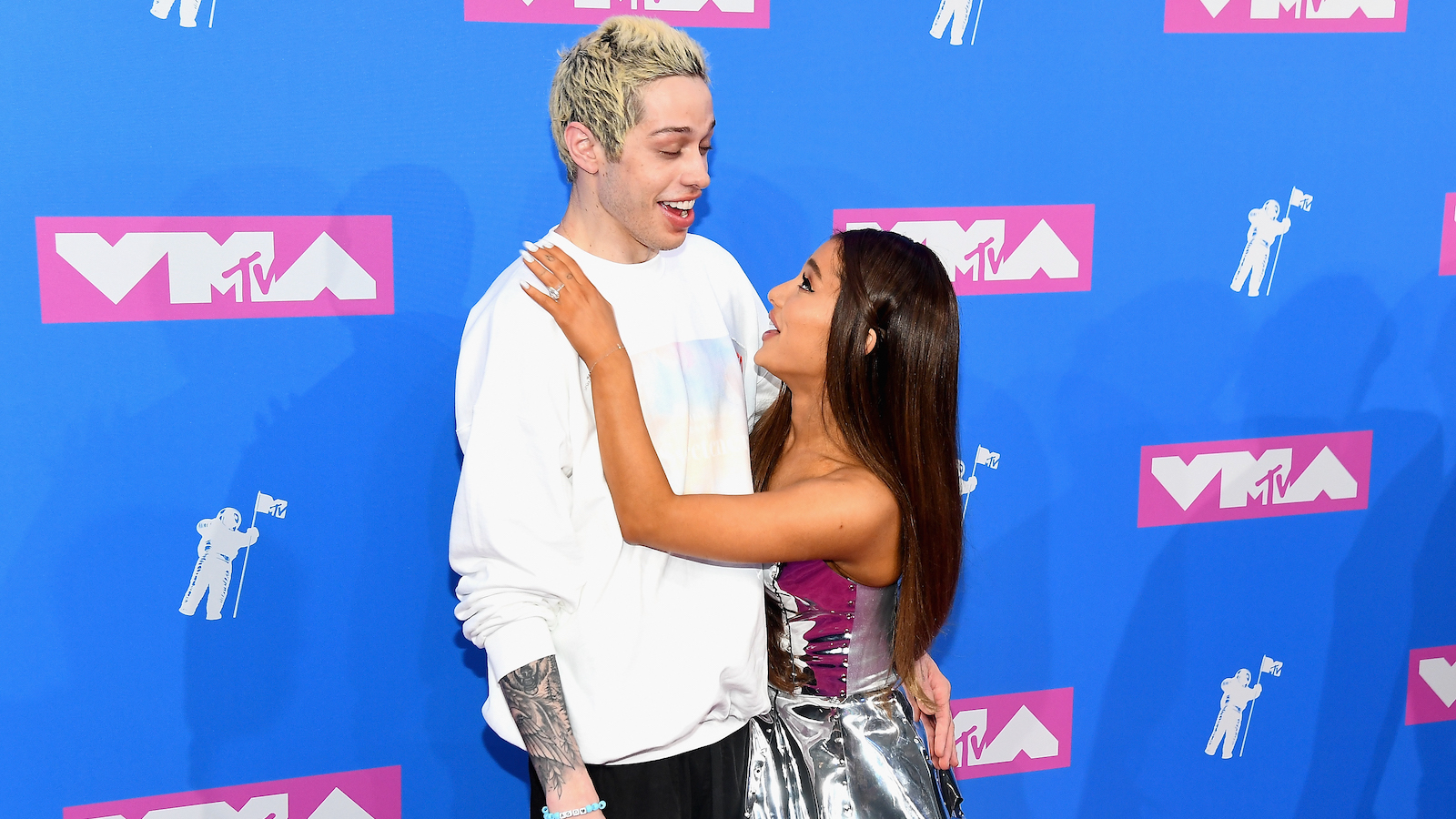 Pete Davidson and Ariana Grande are together on an MTV carpet. 