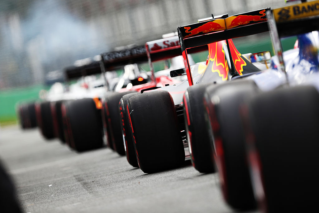 Formula 1 cars waiting to take off before a race.