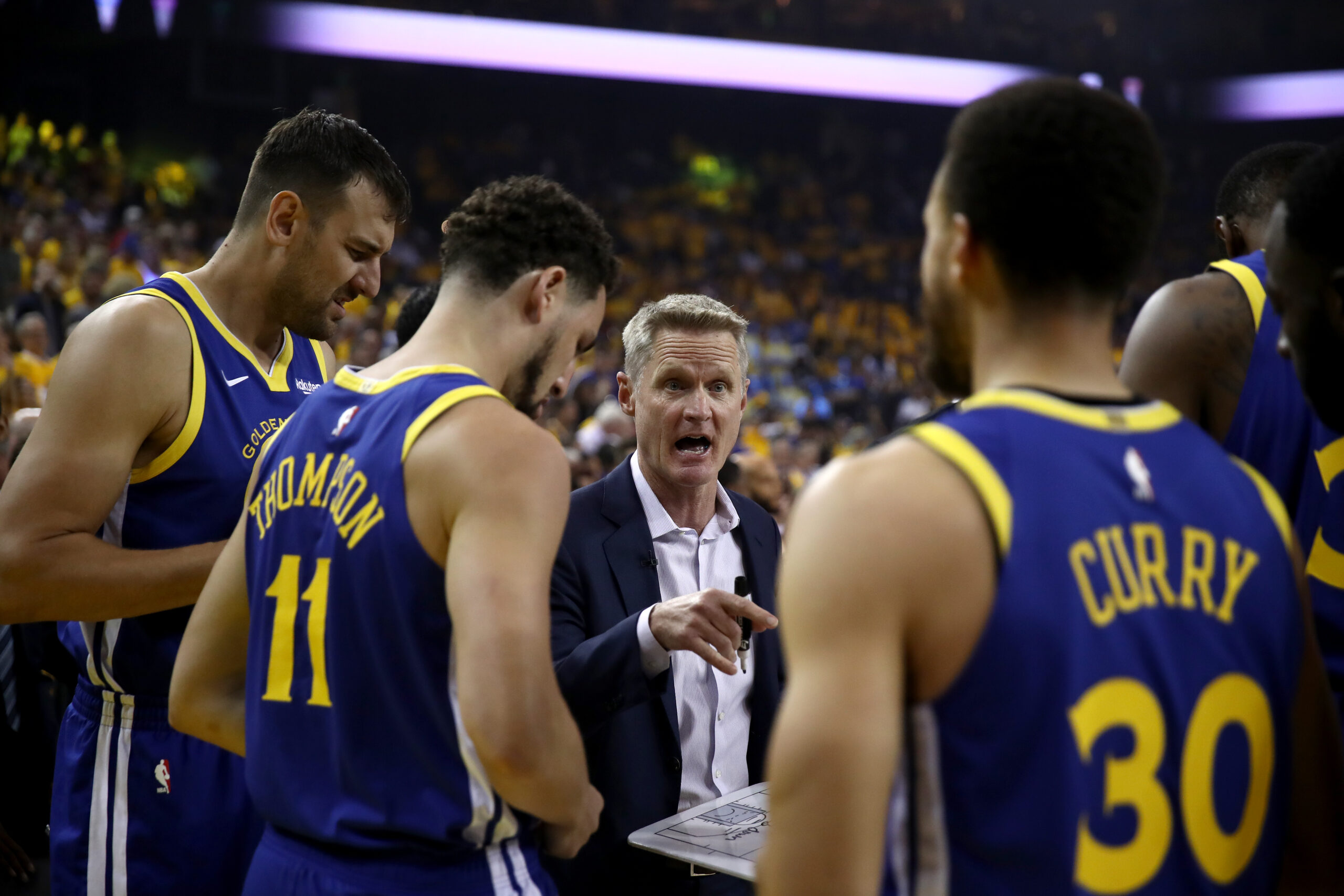 Steve Kerr with Andrew Bogut, Klay Thompson, Steph Curry