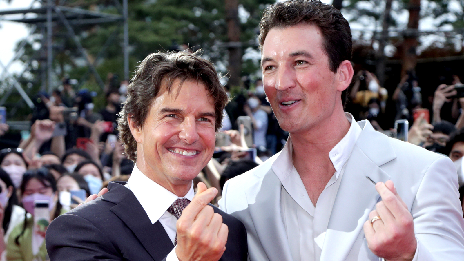 Tom Cruise and Miles Teller