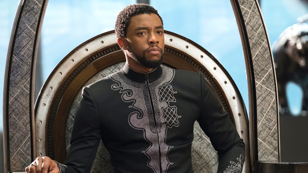 Chadwick Boseman sitting on the Wakanda throne as King T'Challa in 'Black Panther'