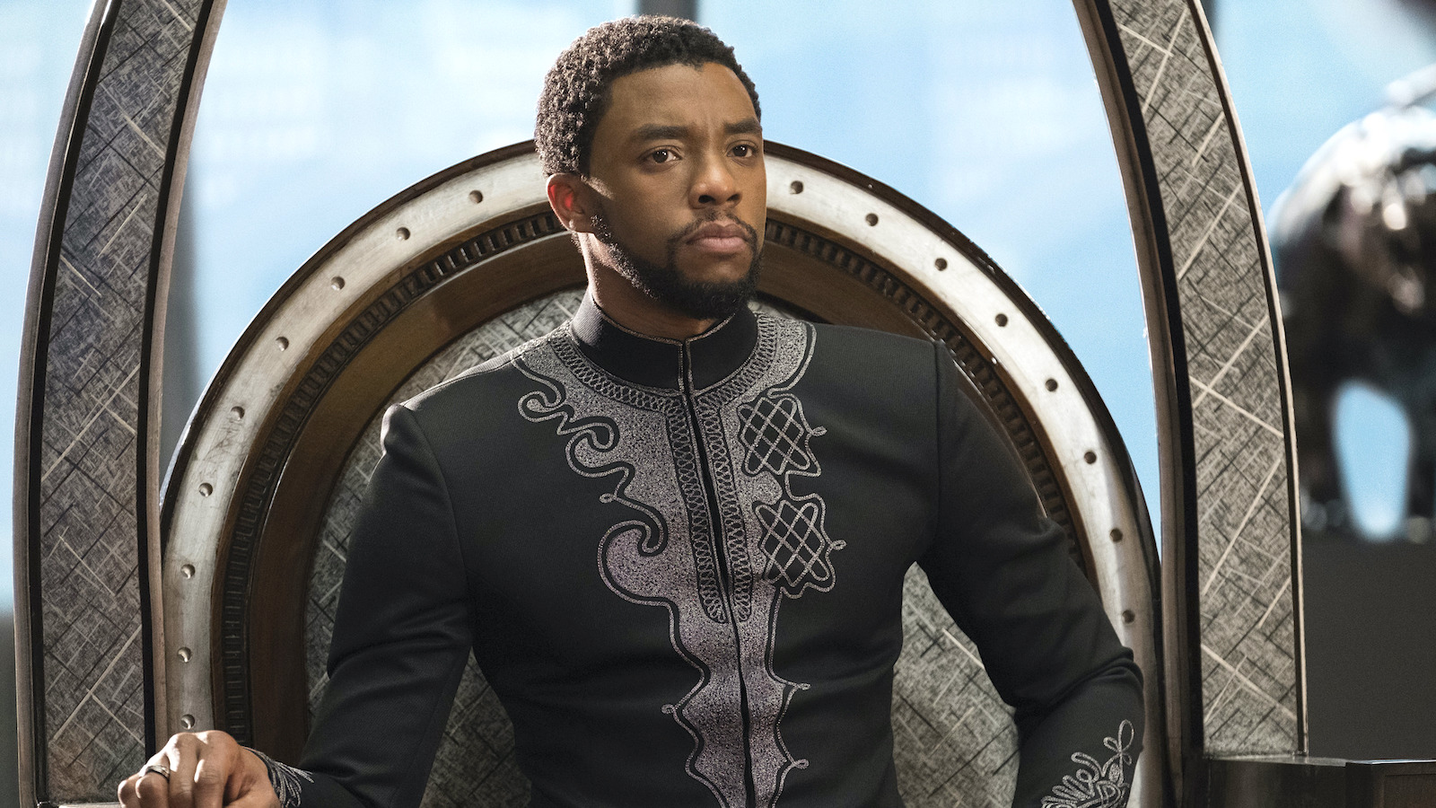 Chadwick Boseman sitting on the Wakanda throne as King T'Challa in 'Black Panther'