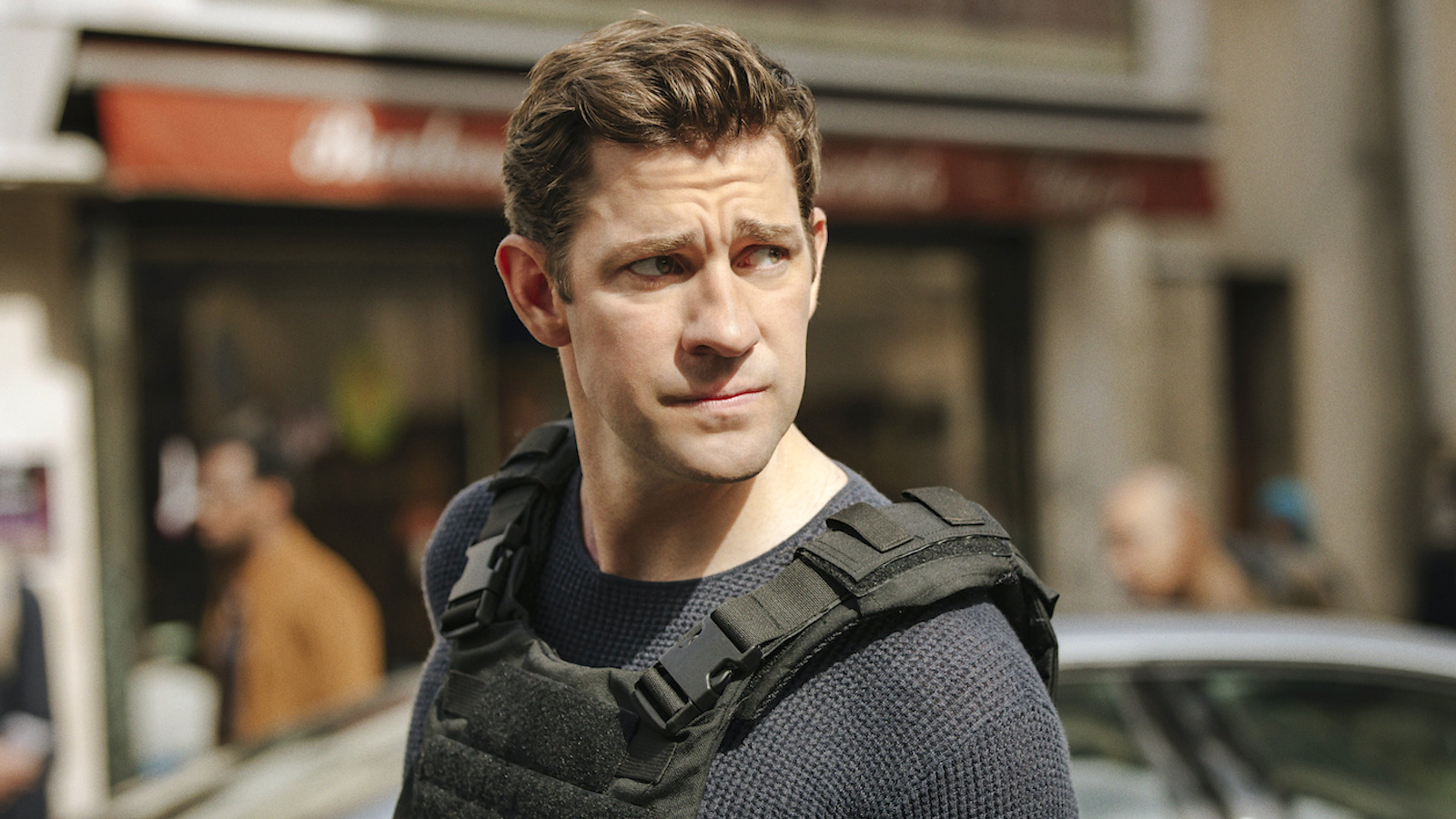 John Krasinski wearing a bulletproof vest as Jack Ryan