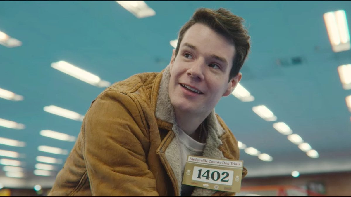Adam Groff (Connor Swindells) grins in a screenshot from 'Sex Education' 