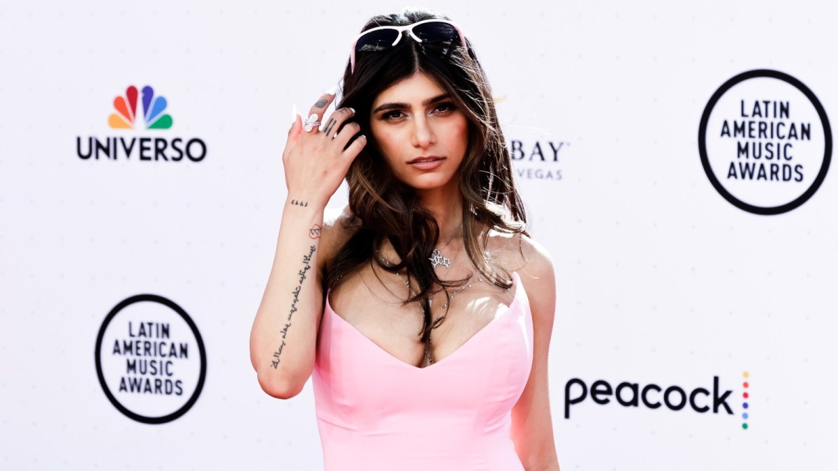 Mia Khalifa wears a pink dress at a red carpet event.