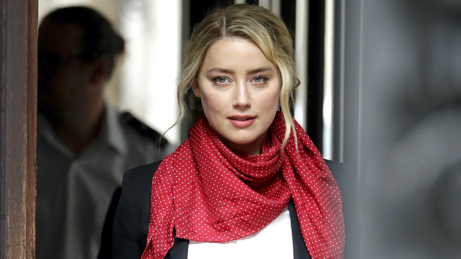 Amber Heard wearing a red bandana as a scarf