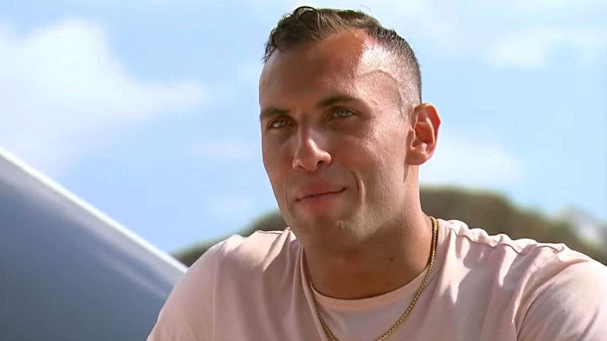 Close up of Peter Izzo with blue skies and clouds in the background