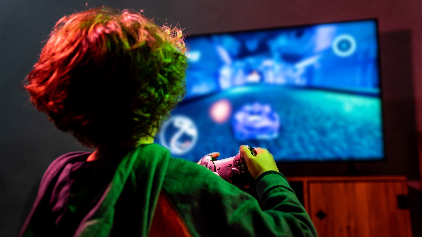 Little boy playing video game - stock photo