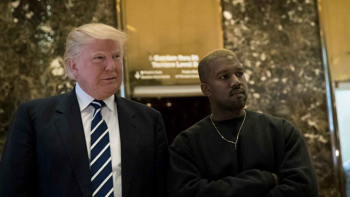 President-elect Donald Trump and Kanye West stand together in the lobby at Trump Tower, December 13, 2016 in New York City.