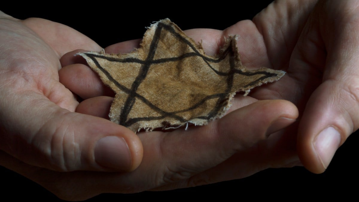 Jewish badge in the hands of a man