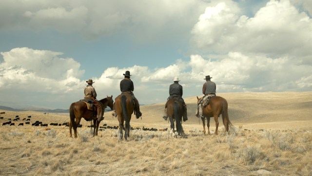The cast of 1923 on horseback, looking out over the open plains