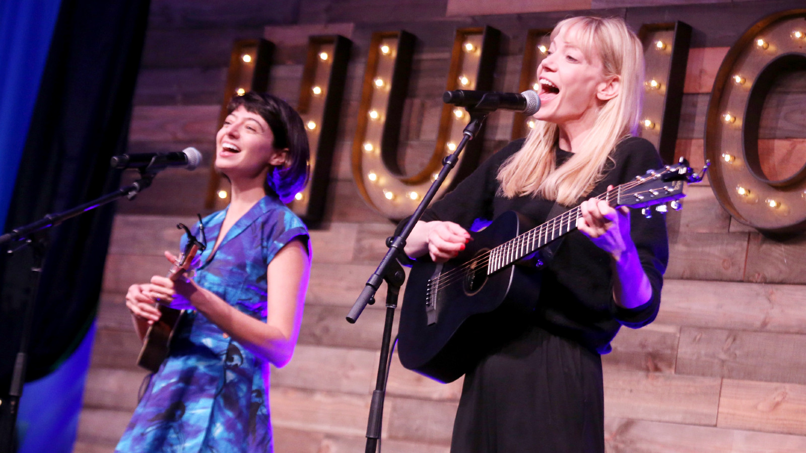 Kate Micucci (L) and Riki Lindhome of Garfunkel and Oates perform in concert during day one of KAABOO Texas at AT&T Stadium on May 10, 2019 in Arlington, Texas.