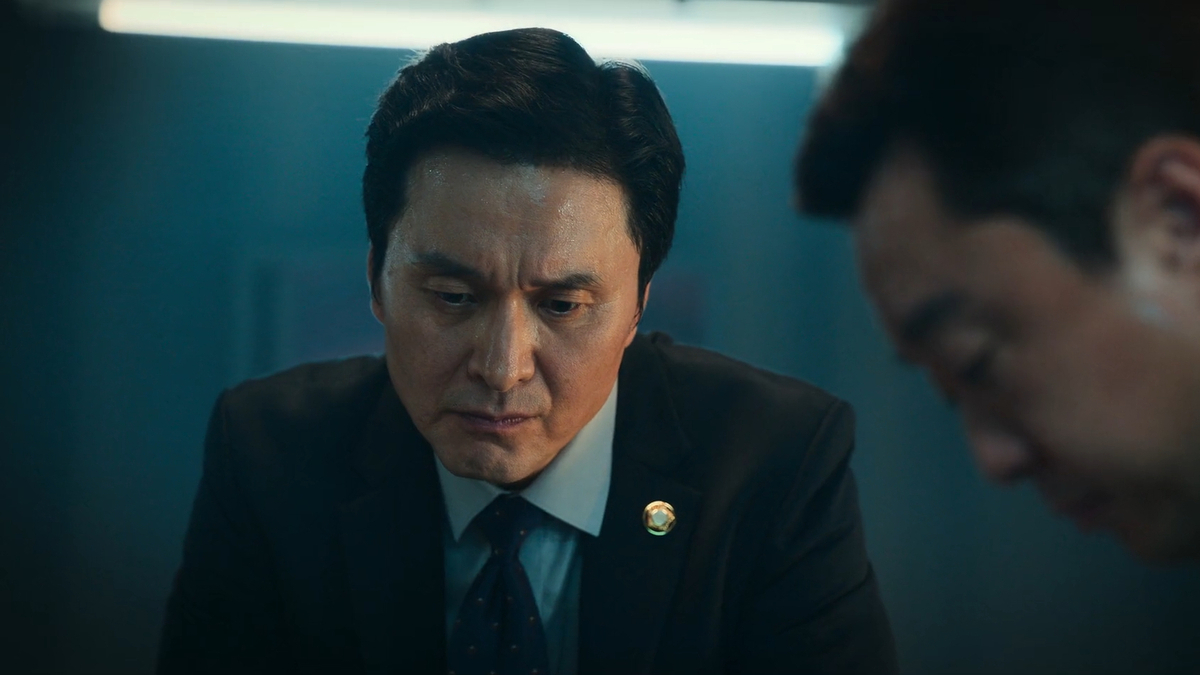 Jang Hyun Sung as Kim Sang Man in Money Heist: Korea