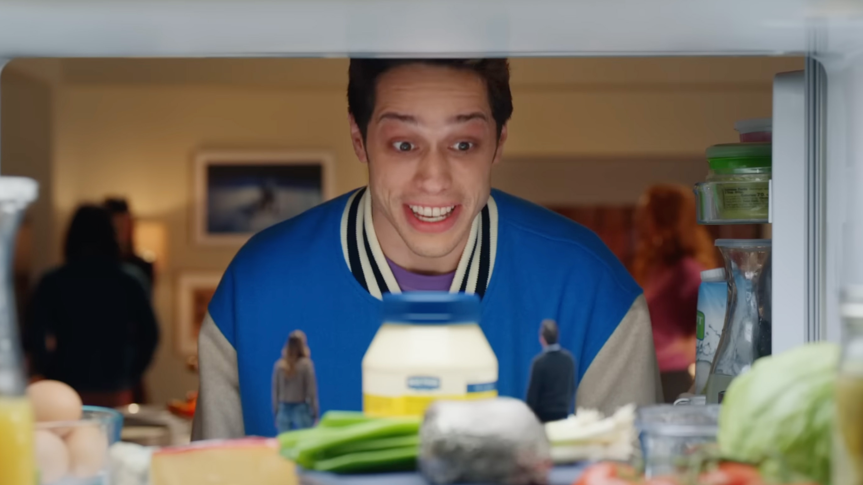 Pete Davidson lookins into a fridge featuring Jon Hamm and Brie Larson