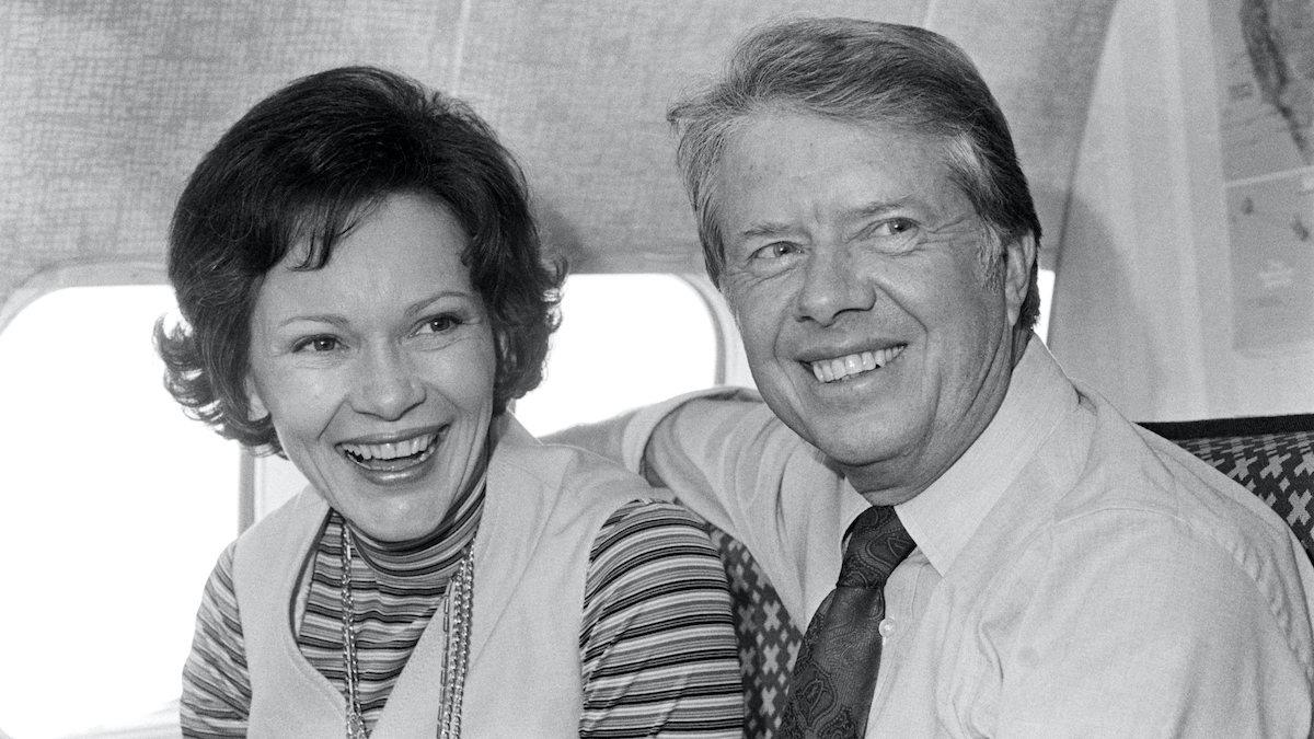 Jimmy Carter, Democratic presidential candidate, and his wife, Rosalynn, share a moment aboard his campaign plane