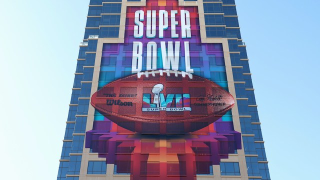 The Super Bowl LVII sign and football on the side of a skyscraper