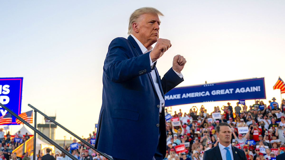 Donald Trump dancing on stage at a rally