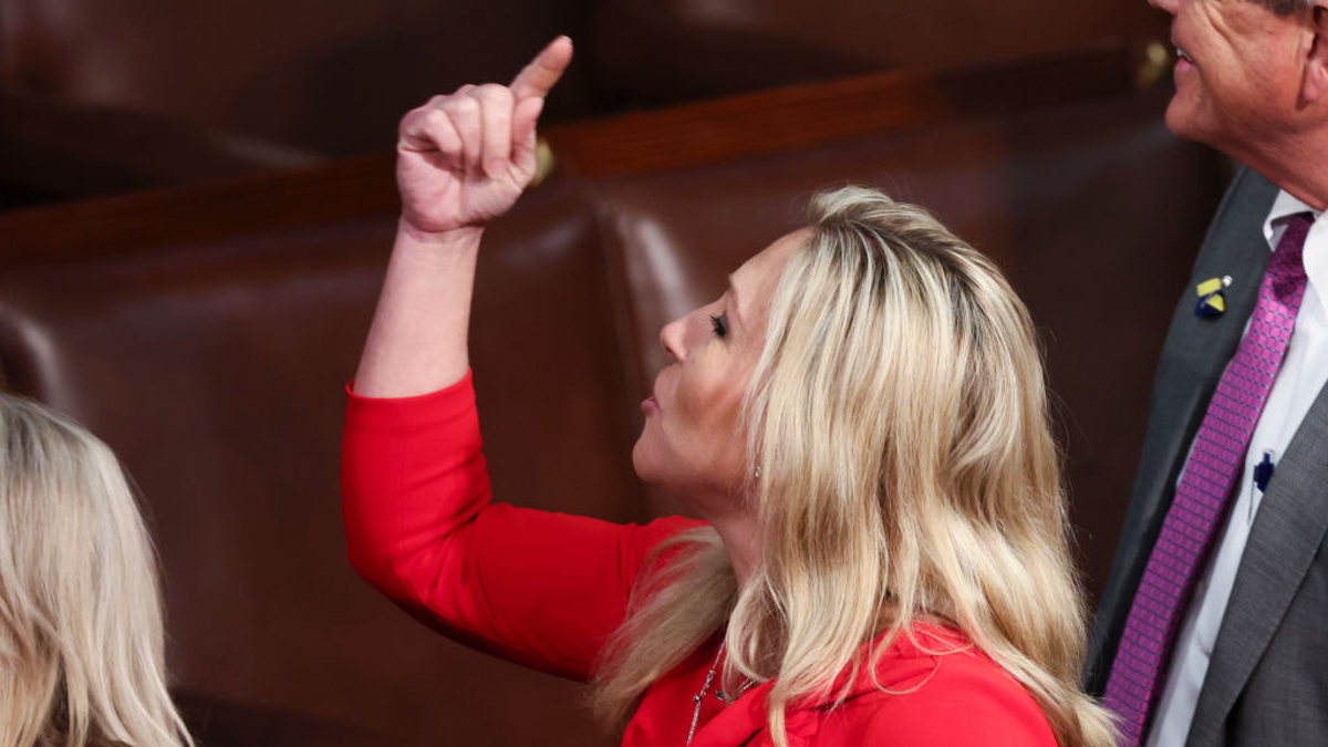 WASHINGTON, DC - MARCH 01: U.S. Rep. Marjorie Taylor Greene (R-GA) gestures after U.S. President Joe Biden finished delivering the State of the Union address during a joint session of Congress in the U.S. Capitol’s House Chamber March 01, 2022 in Washington, DC