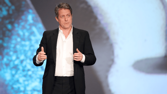 Host Hugh Grant speaks on stage during the 2020 Laureus World Sports Awards at Verti Music Hall on February 17, 2020 in Berlin, Germany.