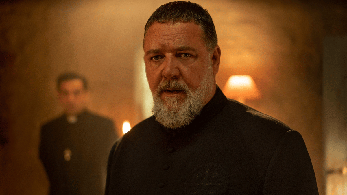 Gabriele Amorth (Russell Crowe) stunned by the sight of something off-screen in 'The Pope's Exorcist'