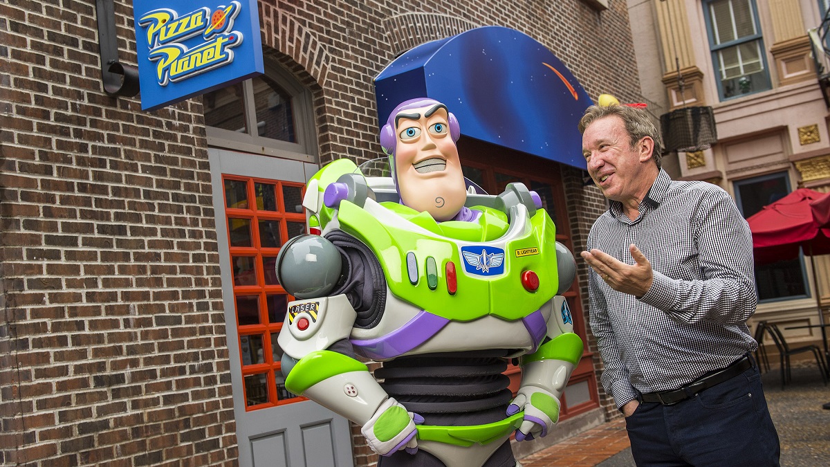 LAKE BUENA VISTA, FL - DECEMBER 31: In this handout photo provided by Disney Parks, actor and comedian Tim Allen, the voice of Buzz Lightyear in the Disney-Pixar "Toy Story" series of animated films, poses with Buzz Lightyear December 31, 2014 at Disney's Hollywood Studios theme park in Lake Buena Vista, Florida. Allen, who also starred on the hit TV series "Home Improvement" and in live-action motion pictures like "The Santa Clause," is visiting the Walt Disney World Resort to ring in the new year.