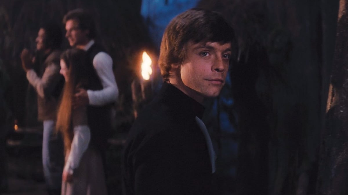 Luke Skywalker smiles at the ghost of his father