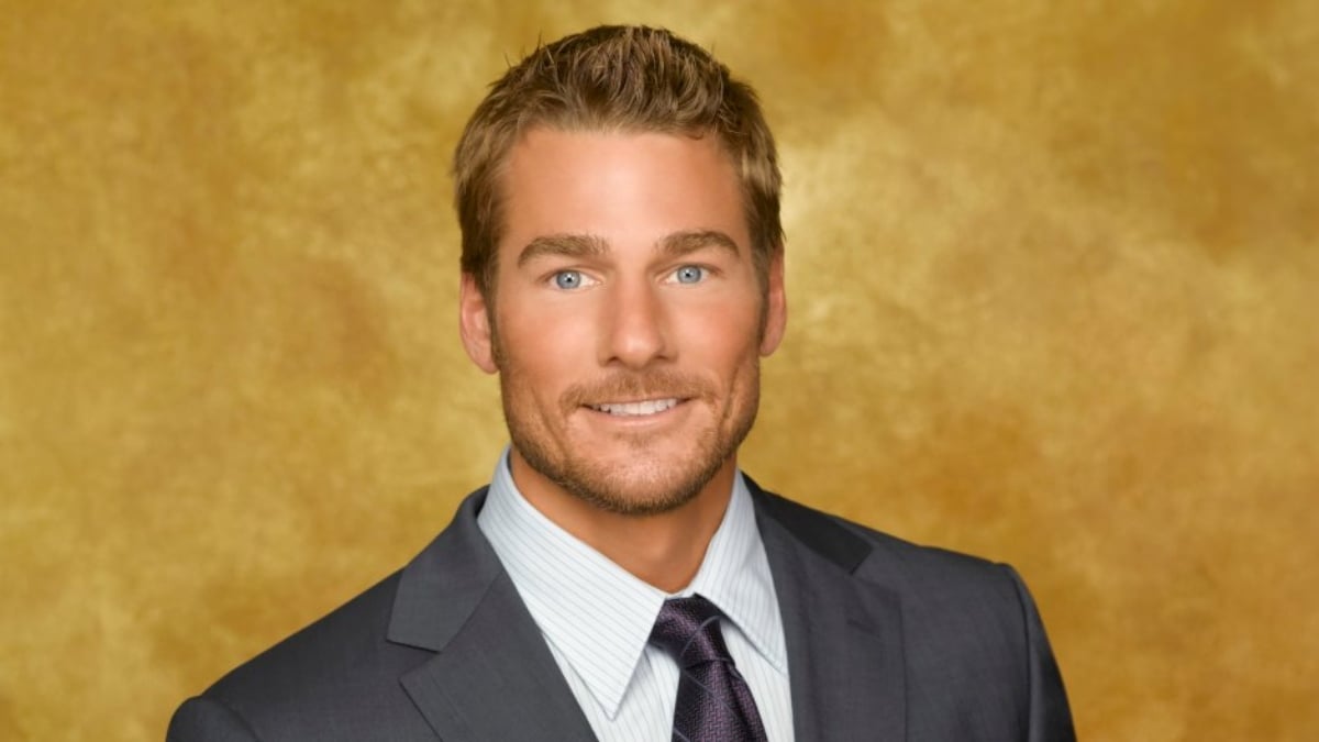 Brad Womack is smiling at the camera in front of a yellow background.