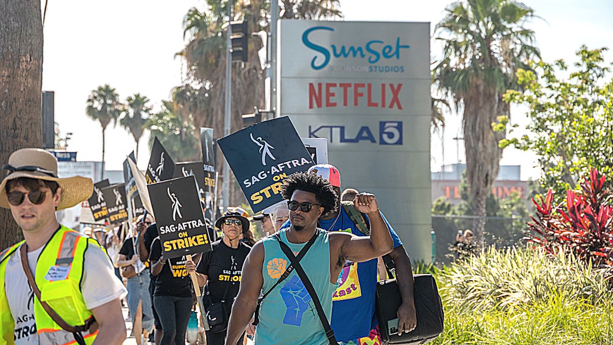 LOS ANGELES, CALIFORNIA - JULY 21: Members Of SAG-AFTRA and WGA go on strike at Netflix, Sunset Gower and Paramount Studios on July 21, 2023 in Los Angeles, California. Members of SAG-AFTRA, Hollywood's largest union which represents actors and other media professionals, have joined striking WGA (Writers Guild of America) workers in the first joint walkout against the studios since 1960. The strike could shut down Hollywood productions completely with writers in the third month of their strike against the Hollywood studios. 