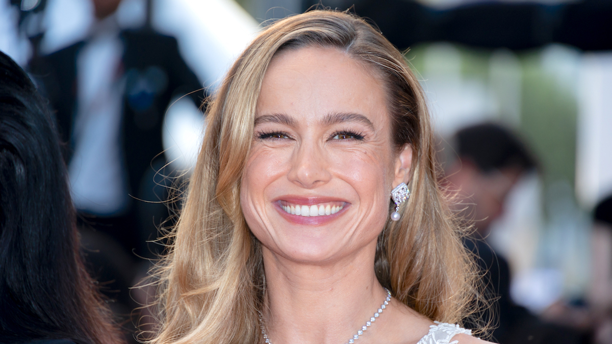 Brie Larson smiling brightly at the 76th Annual Cannes Film Festival