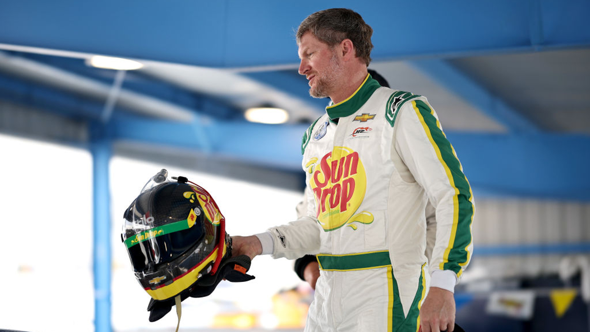 Dale Earnhardt Jr. stands in the garage area during the Mazda MX-5 Cup Test at Martinsville Speedway on August 22, 2023 in Martinsville, Virginia. 