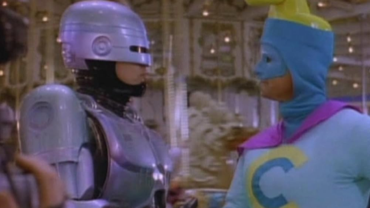 RoboCop shaking hands with Commander Cash