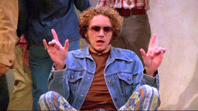 Danny Masterson as Hyde, sitting on the floor