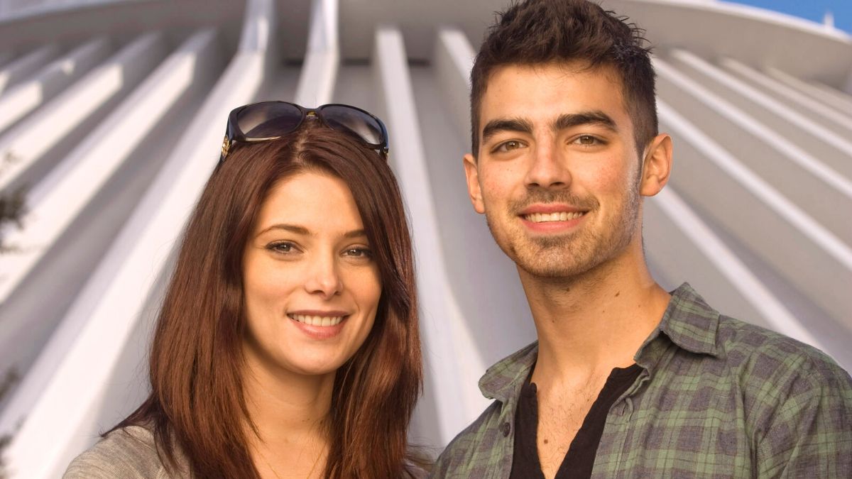 LAKE BUENA VISTA, FL - DECEMBER 29: In this handout photo provided by Disney, "Twilight" star Ashley Greene (L) poses with actor/singer Joe Jonas of the pop-rock trio "Jonas Brothers," in front of Space Mountain at the Magic Kingdom on December 29, 2010 in Lake Buena Vista, Florida. The Magic Kingdom is one of four theme parks at Walt Disney World in Florida. (Photo by Kent Phillips/Disney via Getty Images)