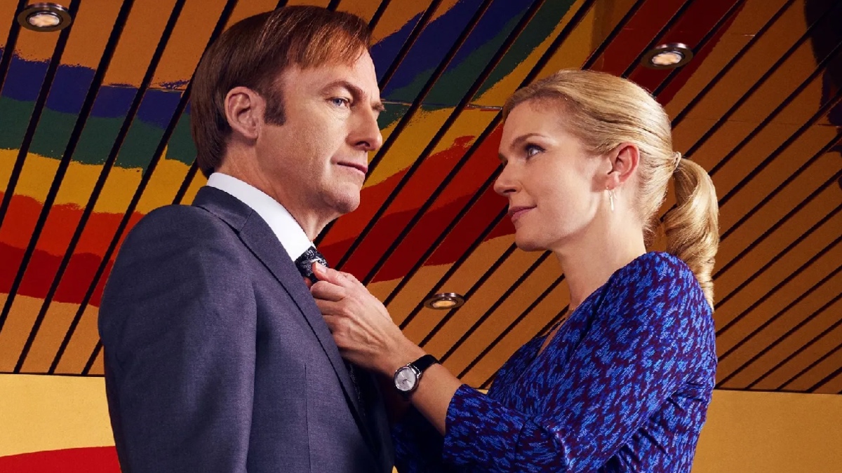 Kim Wexler adjusts Jimmy McGill's tie in their shared law offices.