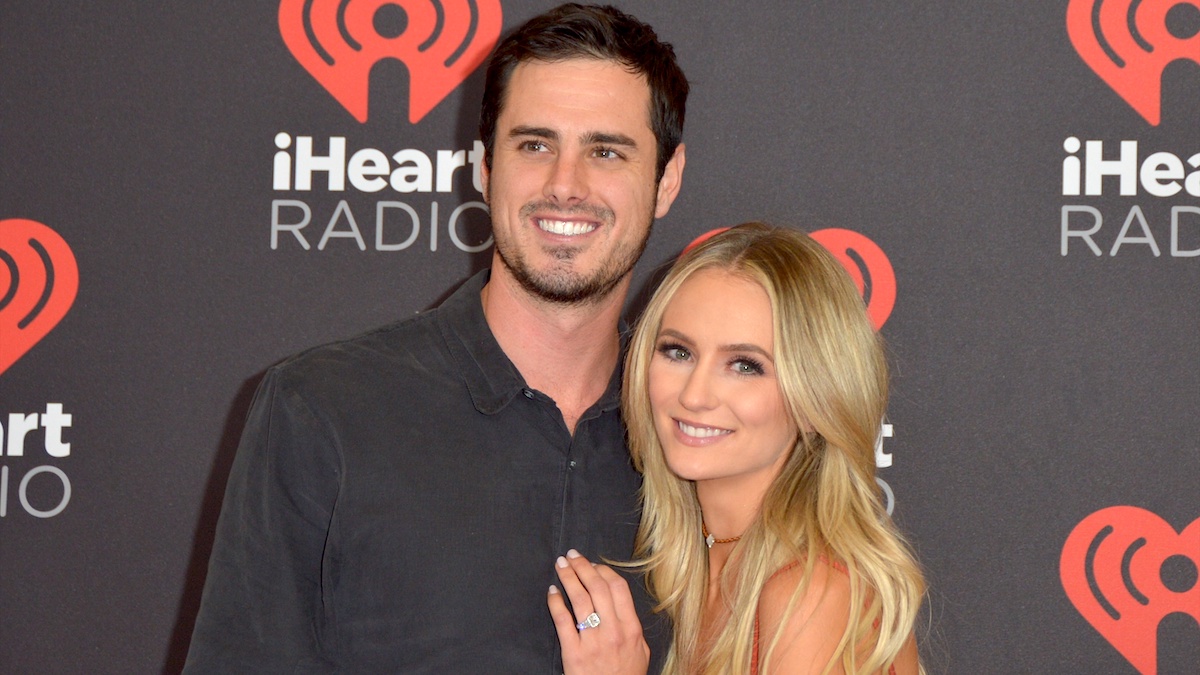 Lauren Bushnell and ben Higgins on the iHeart Radio red carpet, both smiling.