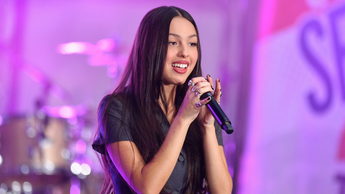 Olivia sings at a summer concert series.