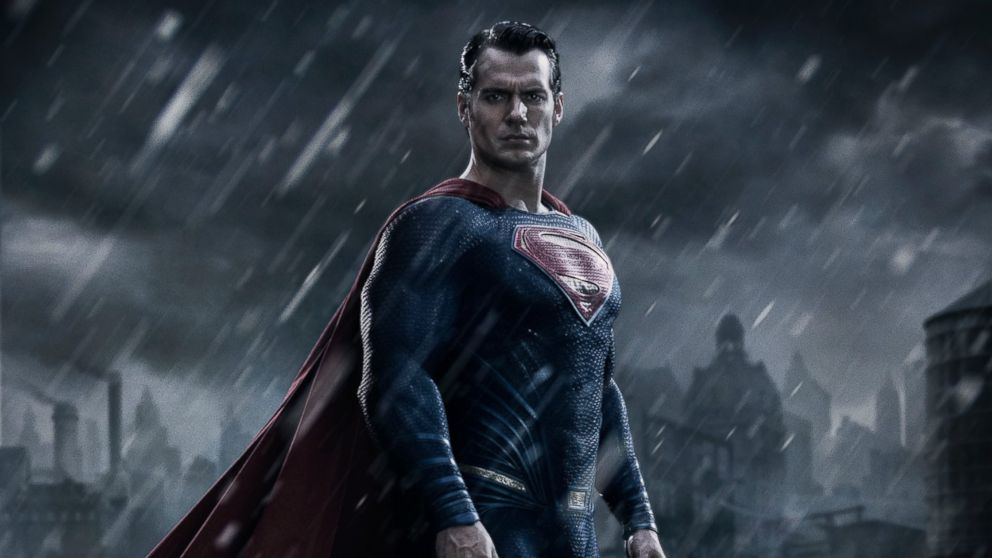 Henry Cavill is posing as Superman in the rain in Batman v Superman: Dawn of Justice.